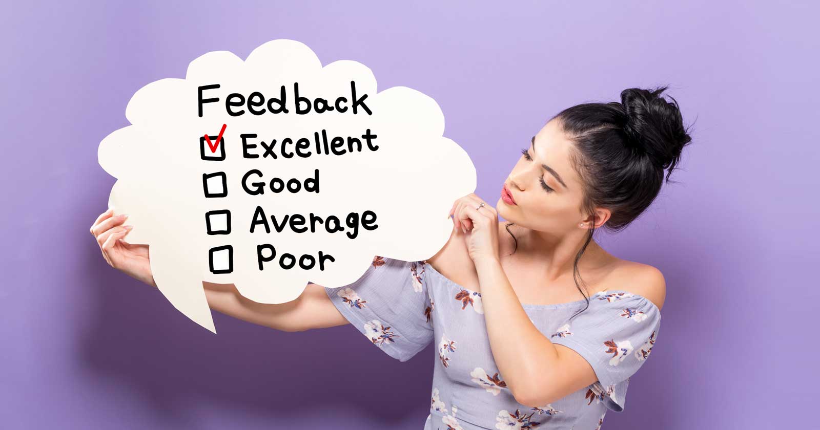 Woman holding feedback checklist